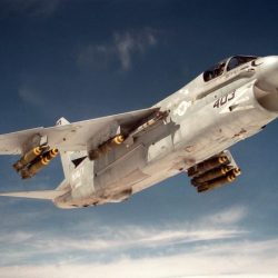 A fighter jet is launched from an aircraft carrier